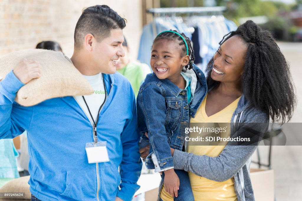 Diverse family donates items during food drive
