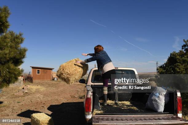 Aubrey Lykins works on chores at home on December 20, 2017 in Walsenburg, Colorado. Lykins grew up in Walsenburg, but moved away to Columbus, Ohio,...