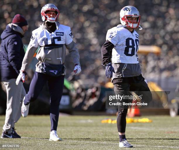 New England Patriots wide receivers Chris Hogan, left, and Danny Amendola, right, participate in a drill during practice at Gillette Stadium in...