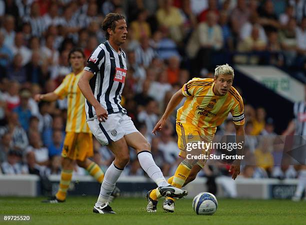 West Brom defender Jonas Olsson is closed down by Alan Smith during the Coca Cola Championship game between West Bromwich Albion and Newcastle United...