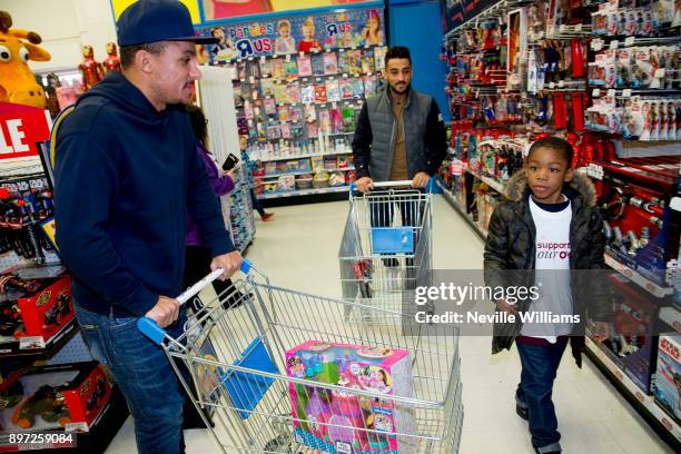 Aston Villa players Neil Taylor and Gabriel Agbonlahor join the Hayden family from Kingstanding, Birmingham on a 'Supermarket Sweep' at the Toys 'R'...
