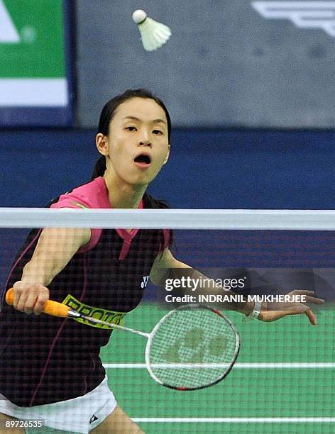 Malaysia's Wong Mew Choo plays a shot against Shannon Pohl of USA during the women's singles first round badminton match of the World Badminton...