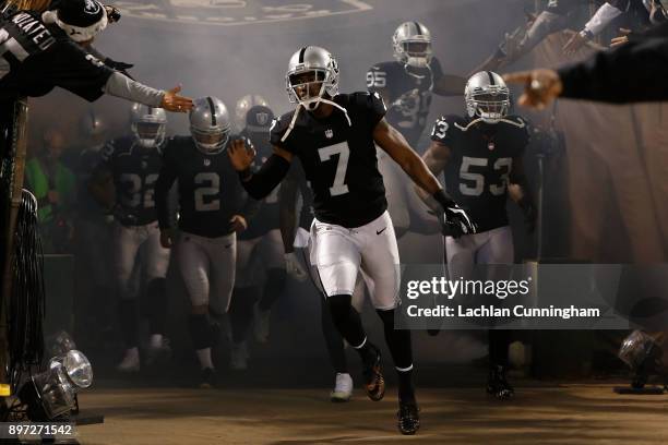 Punter Marquette King of the Oakland Raiders leads the team onto the field for the game against the Dallas Cowboys at Oakland-Alameda County Coliseum...