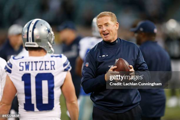 Head coach of the Dallas Cowboys, Jason Garrett, chats to Cole Beasley before the game against the Oakland Raiders at Oakland-Alameda County Coliseum...