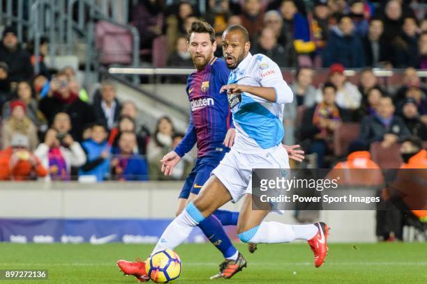Sidnei da Silva Junior of RC Deportivo La Coruna fights for the ball with Lionel Messi of FC Barcelona during the La Liga 2017-18 match between FC...