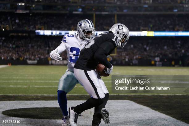 Michael Crabtree of the Oakland Raiders catches a touchdown against Chidobe Awuzie of the Dallas Cowboys at Oakland-Alameda County Coliseum on...