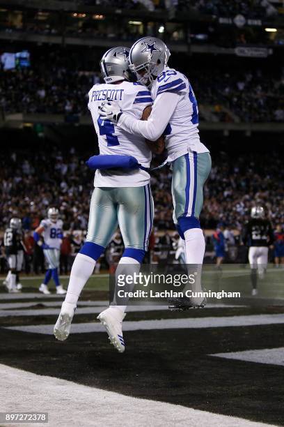 Quarterback Dak Prescott of the Dallas Cowboys celebrates with Terrance Williams after scoring a touchdown against the Oakland Raiders at...