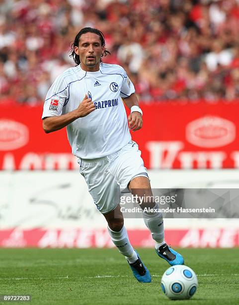 Kevin Kuranyi of Schalke runs with the ball during the Bundesliga match between 1. FC Nuernberg and Schalke 04 at the Easy Credit Stadium on August...