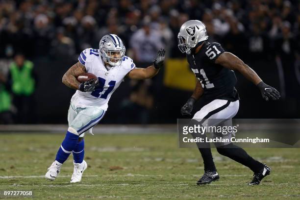 Keith Smith of the Dallas Cowboys competes against Bruce Irvin of the Oakland Raiders at Oakland-Alameda County Coliseum on December 17, 2017 in...