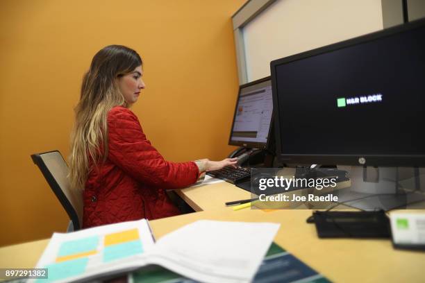 Roxana Butron, H&R Block Master Tax Advisor, uses her computer to take a continuing tax code education course on the day President Donald Trump...