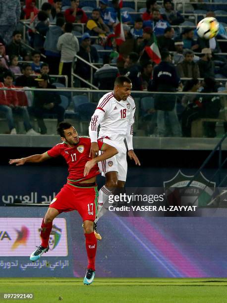 Emirates' Mohammad Jawhar vies for the ball with Oman's Ali al-Busaedi during their 2017 Gulf Cup of Nations football match between UAE and Oman at...