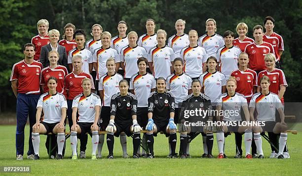 Players and team members of Germany's women national football team pose for a group picture on August 10, 2009 in Neu Isenburg, western Germany. Head...