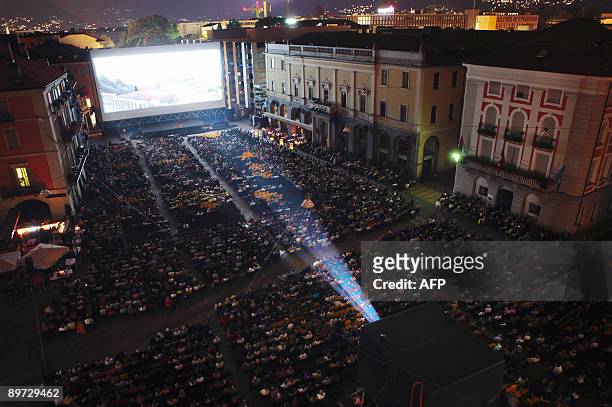 General view of spectators seated infront of the giant screen at the Piazza Grande during the 62nd Locarno international film festival on late August...