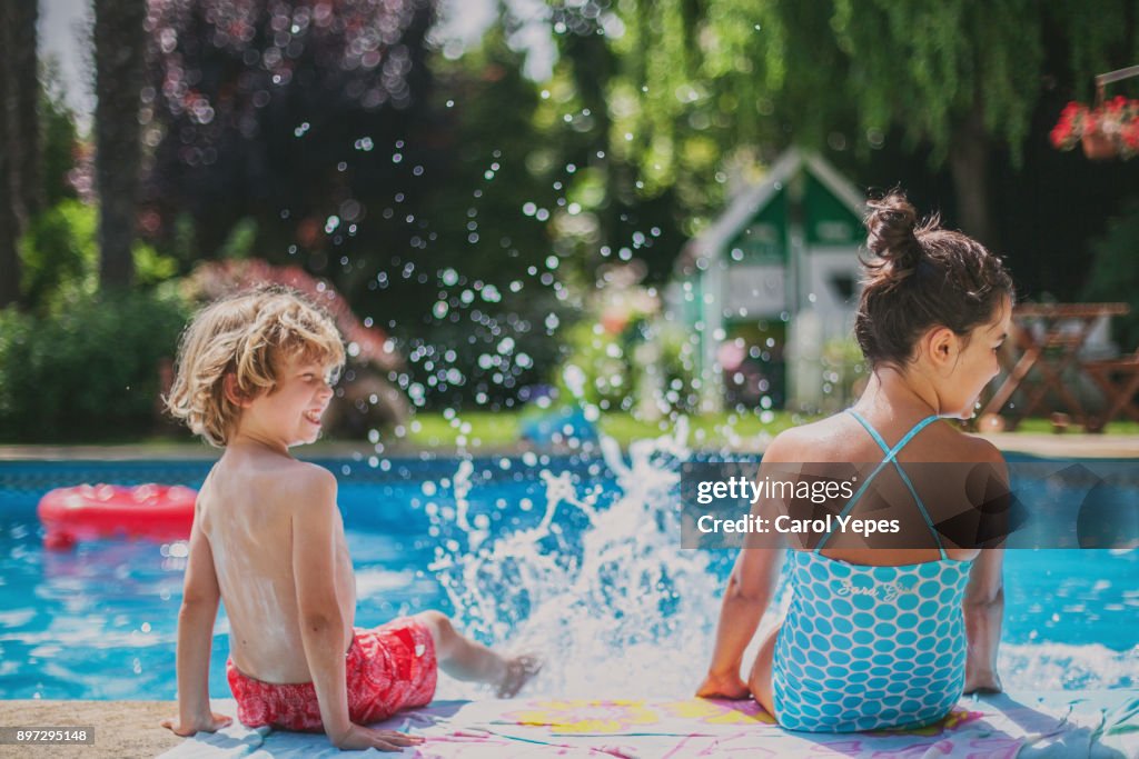 Two kids having fun in pool
