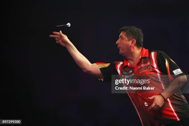 Mensur Suljovic of Austria in action during the second round match against Robert Thornton of Scotland on day nine of the 2018 William Hill PDC World...