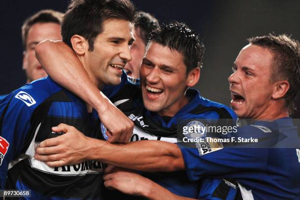 Andre Mijatovic, Giovanni Federico and Arne Feick of Bielefeld celebrate their third goal during the second Bundesliga match between Arminia...