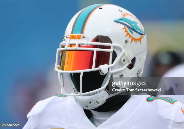 Kenny Stills of the Miami Dolphins warms up as he looks through his tinted visor before the start of NFL game action against the Buffalo Bills at New...