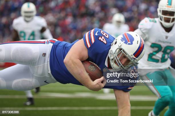 Nick O'Leary of the Buffalo Bills is upended as he runs with the ball during NFL game action against the Miami Dolphins at New Era Field on December...