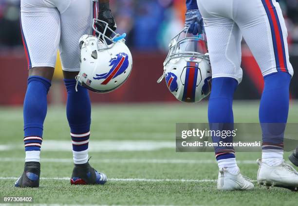 Tre'Davious White of the Buffalo Bills and Jordan Poyer hold their helmets by their side during a break in the action of their NFL game against the...