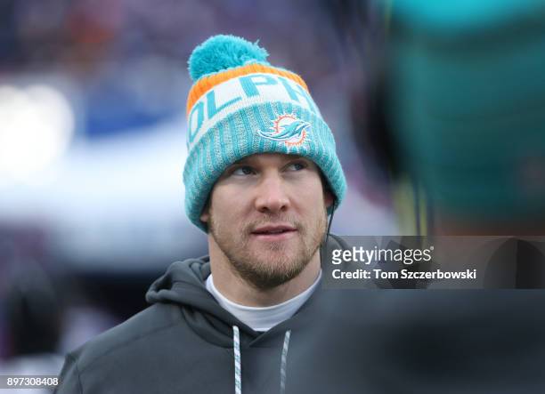 Ryan Tannehill of the Miami Dolphins looks on from the sideline during NFL game action against the Buffalo Bills at New Era Field on December 17,...