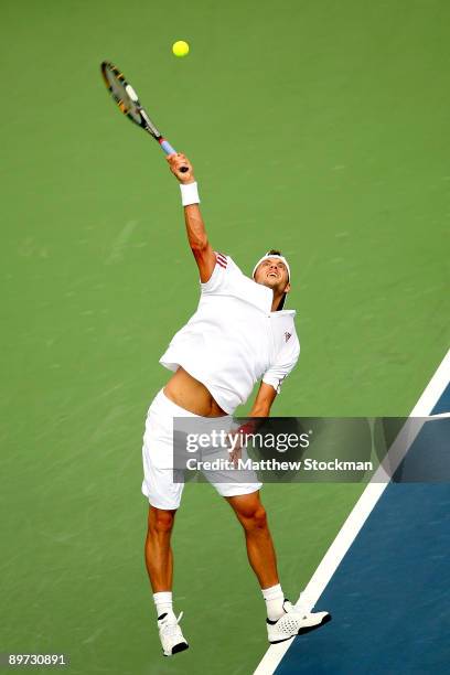 Paul-Henri Mathieu of France serves to Guillermo Garcia-Lopez of Spain during the Rogers Cup at Uniprix Stadium August 10, 2009 in Montreal, Quebec,...