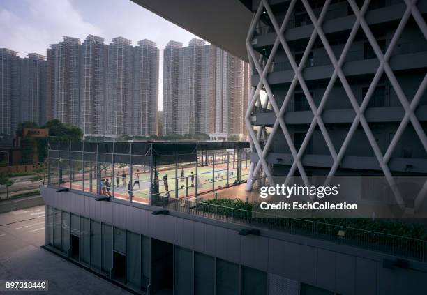 playing basketball at modern residential neighbourhood in hong hong - hong kong lifestyle society health stock pictures, royalty-free photos & images