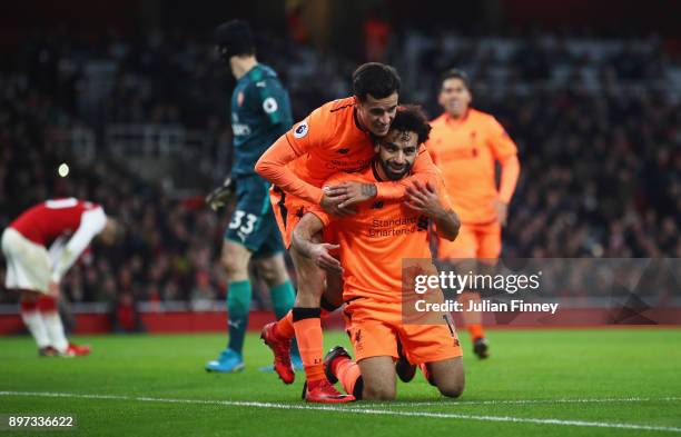 Mohamed Salah of Liverpool celebrates as he scores their second goal with Philippe Coutinho during the Premier League match between Arsenal and...