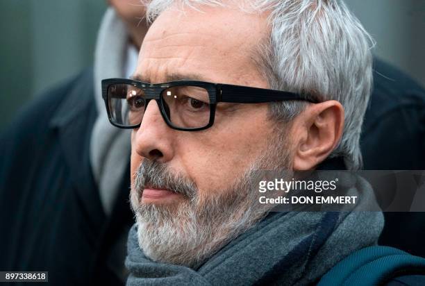 Julio Barbosa, attorney for Jose Maria Marin of Brazil, one of three defendants in the FIFA scandal, talks to the media as he departs the Federal...