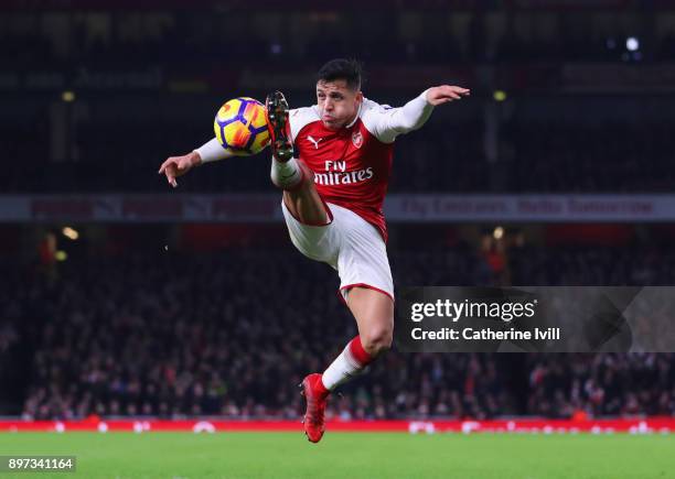 Alexis Sanchez of Arsenal controls the ball during the Premier League match between Arsenal and Liverpool at Emirates Stadium on December 22, 2017 in...