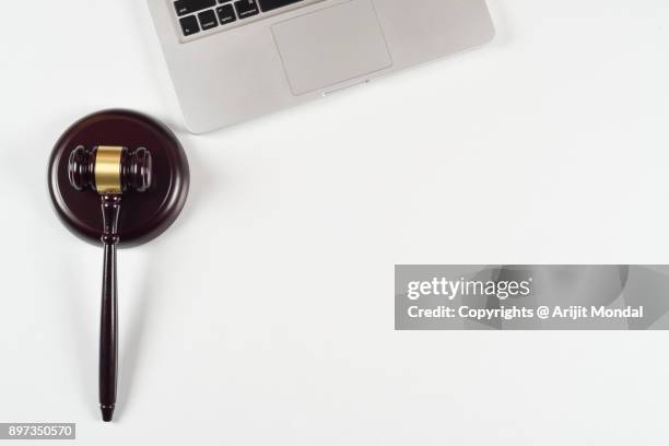 top view of gavel and sound block with laptop on white legal occupation desk flat lay copy space - bid paddle stock pictures, royalty-free photos & images