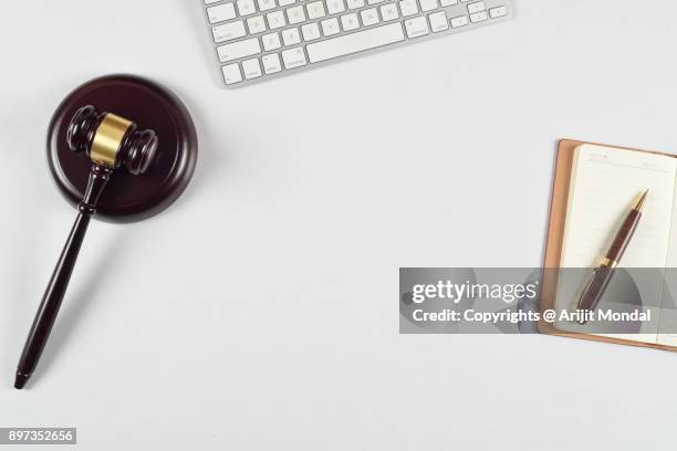 top view flat lay modern lawyer office desk with gavel and sound block, computer keyboard - bid paddle stock pictures, royalty-free photos & images