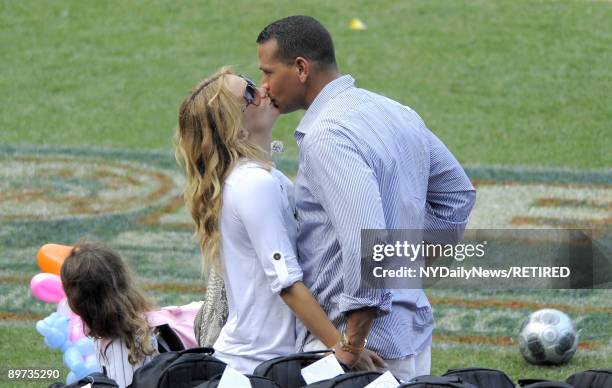 New York Yankees slugger Alex Rodriguez and actress Kate Hudson kiss at Yankees Family Picnic Day July 25, 2009 in New York City.