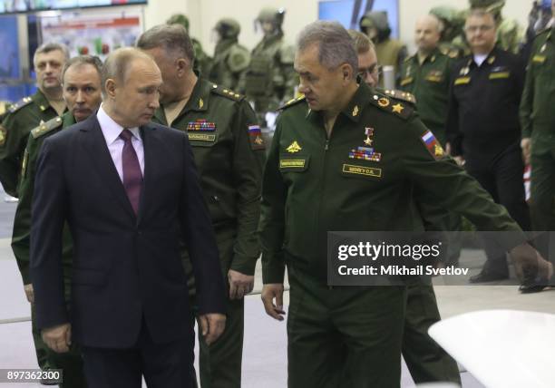 Russian President Vladimir Putin and Defence Minister Sergei Shoigu is visit a military exhibition prior to the Extended Annual Board of Defence...