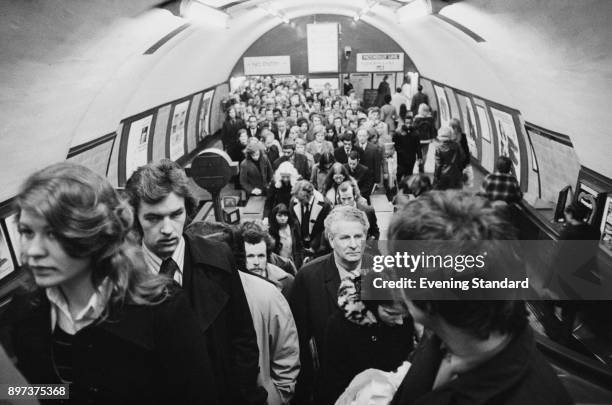 Commuters travelling during rush hour at Holborn Underground Station, London, UK, 20th January 1975.