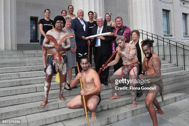 Uncle John Graham of the Yugambeh clan holds the Queens Baton with Taiaha Hawke of Ngati Whatua at Auckland War Memorial Museum during the...