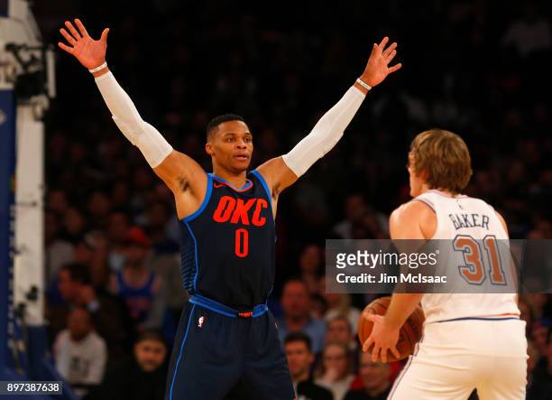 Russell Westbrook of the Oklahoma City Thunder in action against Ron Baker of the New York Knicks at Madison Square Garden on December 16, 2017 in...
