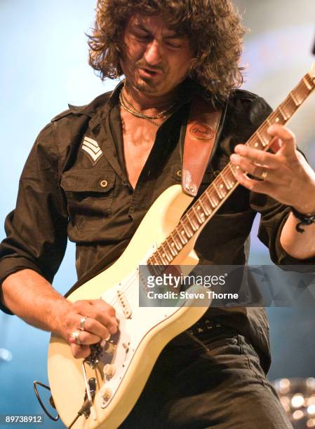 Nico Tamburella of Nico's Alchemy performs on stage playing a scalloped fret Fender Stratocaster on the third day of the Bulldog Bash at Avon Park...