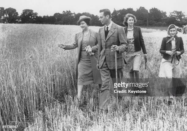 The Queen leads her family on a tour of Sandringham Park, which has been turned over to agricultural production in aid of the war effort, August...