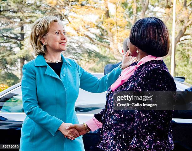 Secretary of State Hillary Clinton shakes the hand of International Relations and Cooperation Minister Maite Nkoana-Mashabane as they give a press...