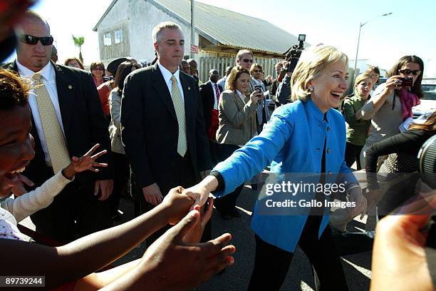 Secretary of State Hillary Clinton pays a visit to the Victoria Mxenge housing project in Gugulethu on August 8, 2009 in Cape Town, South Africa....