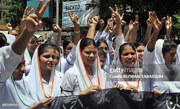 Pakistani Christian nurses shout slogans during a protest in Karachi on August 11 against the killing of Christians in the Pakistani northeastern...