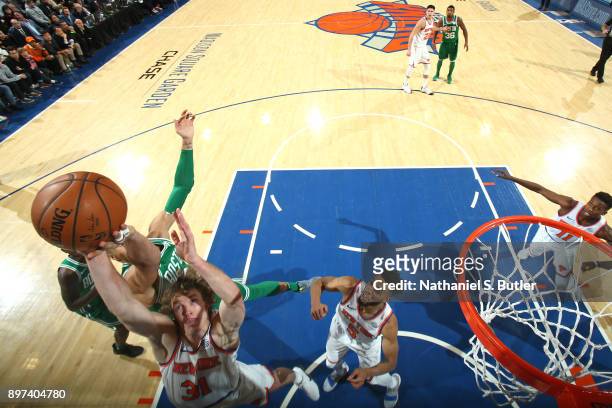 Ron Baker of the New York Knicks shoots the ball against the Boston Celtics on December 21, 2017 at Madison Square Garden in New York City, New York....