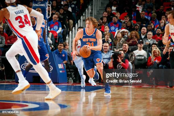 Ron Baker of the New York Knicks handles the ball against the Detroit Pistons on December 22, 2017 at Little Caesars Arena in Detroit, Michigan. NOTE...