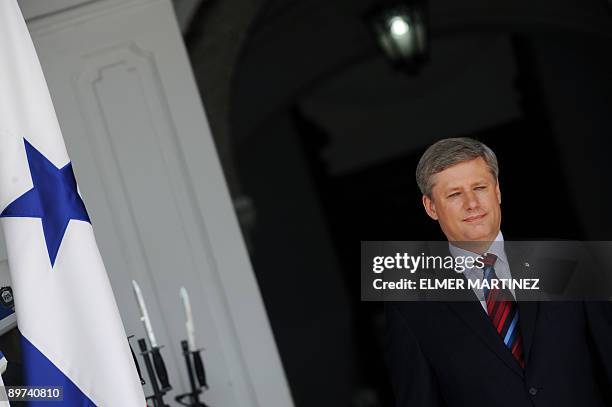 Canadian Prime Minister Stephen Harper poses for the press with Panamanian President Ricardo Martinelli at the presidential palace in Panama City, on...