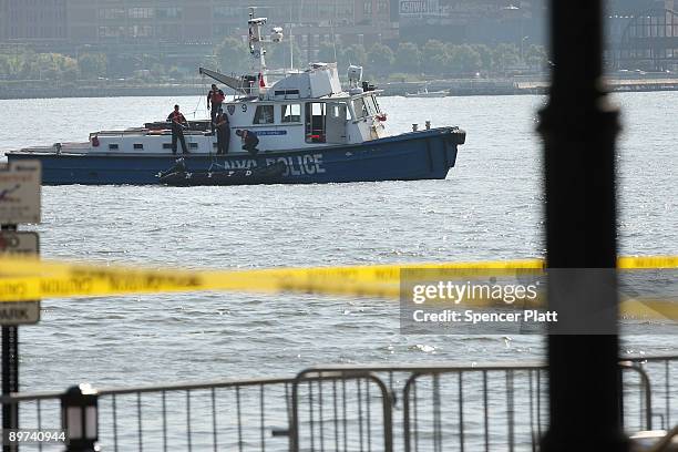 New York City Police vessel patrols the Hudson River near the site where it is believed a plane involved in a mid air collision rests on the river...