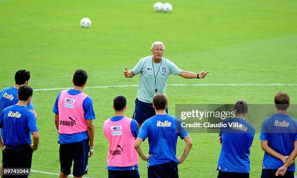 Coach Marcello Lippi of Italy instructs players during a training session ahead of their international friendly match against Switzerland at...