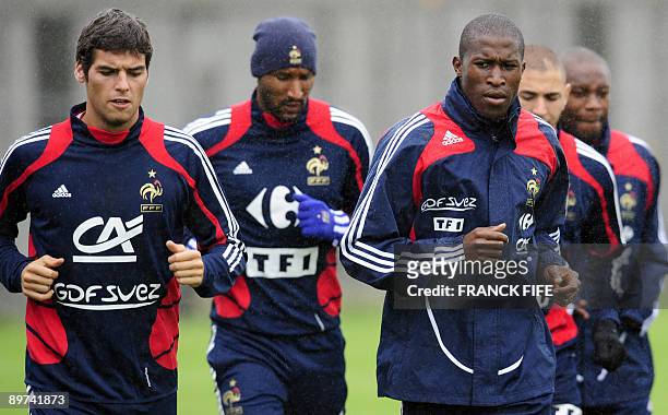 French midfileder Yoann Gourcuff, with teammates forward Nicolas Anelka and midfielder Moussa Sissoko run during a training session, on August 11,...