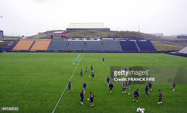 France national football team players warm-up during a training session, on August 11, 2008 at the Torsvollur stadium in Torshavn, on the eve of the...