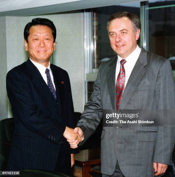 Russian Foreign Minister Andrei Kozyrev and lower house lawmaker Ichiro Ozawa shake hands prior to their meeting on March 21, 1992 in Tokyo, Japan.