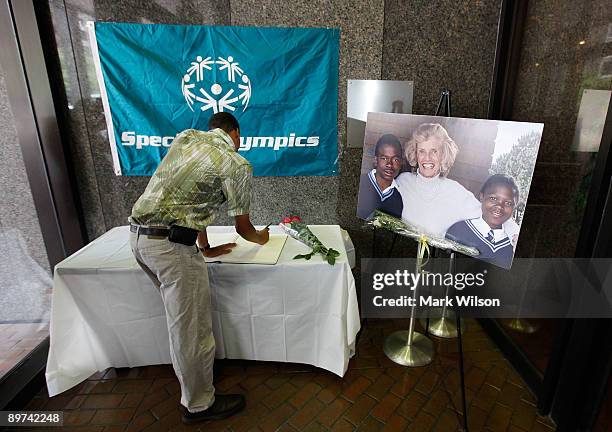 Former special olympian Terriel Limerck signs a condolence book at the Special Olympic headquarters on August 11, 2009 in Wahington, DC. President...